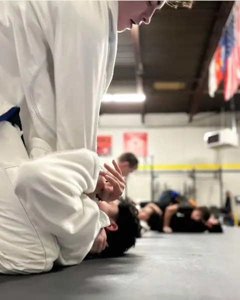 Close-up of gi grips during a roll